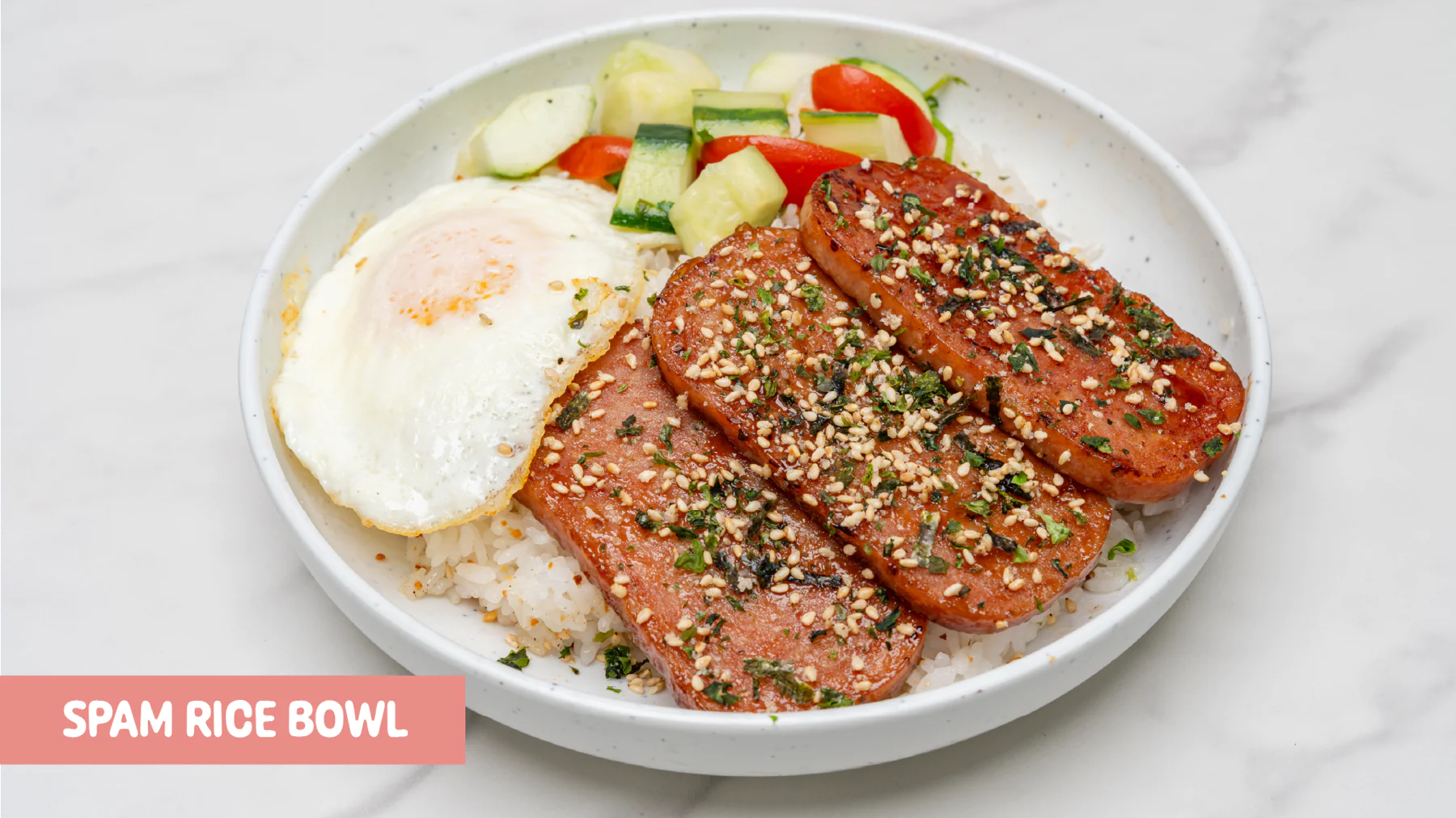 Grilled Spam over garlic rice with G2G Spam sauce, over-easy egg, cucumber-tomato-cilantro salad, and furikake at Gud2Go Cafe, The Union in Garey, Pomona, CA.
